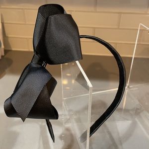 Handmade black grosgrain bow on satin wrapped band